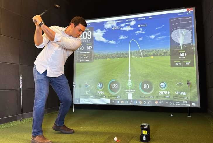 Golfer using fast indoor simulator